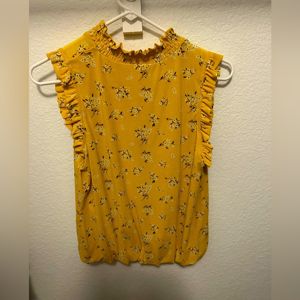 Great to dress up or down blouse. Very light material.